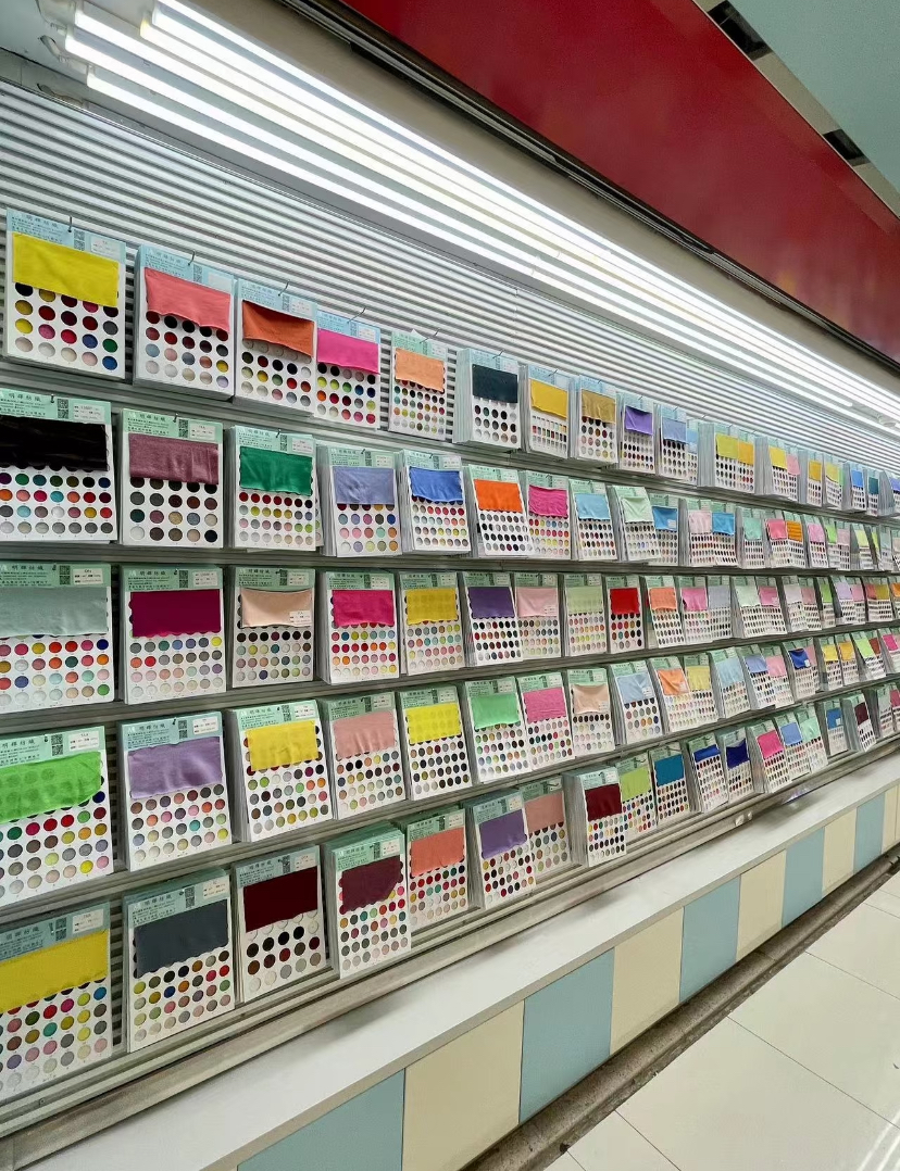 Garment workers cutting and stitching fabric